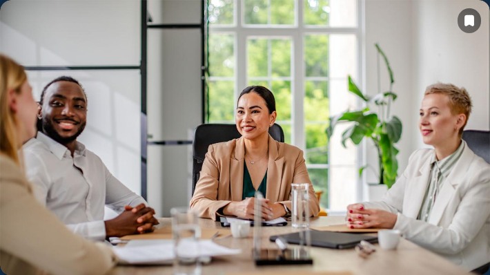 Colleagues engaging in a positive workplace meeting